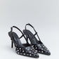 Tacón negro tachuelas