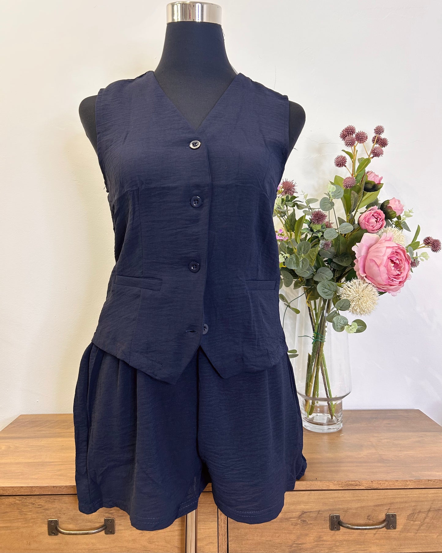 Conjunto de pantalones corto y chaquetilla