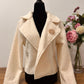 Chaqueta cropped rizo beige